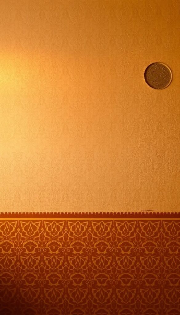 A warm-toned, intricately patterned Moroccan-inspired wall with a detailed stenciled design.